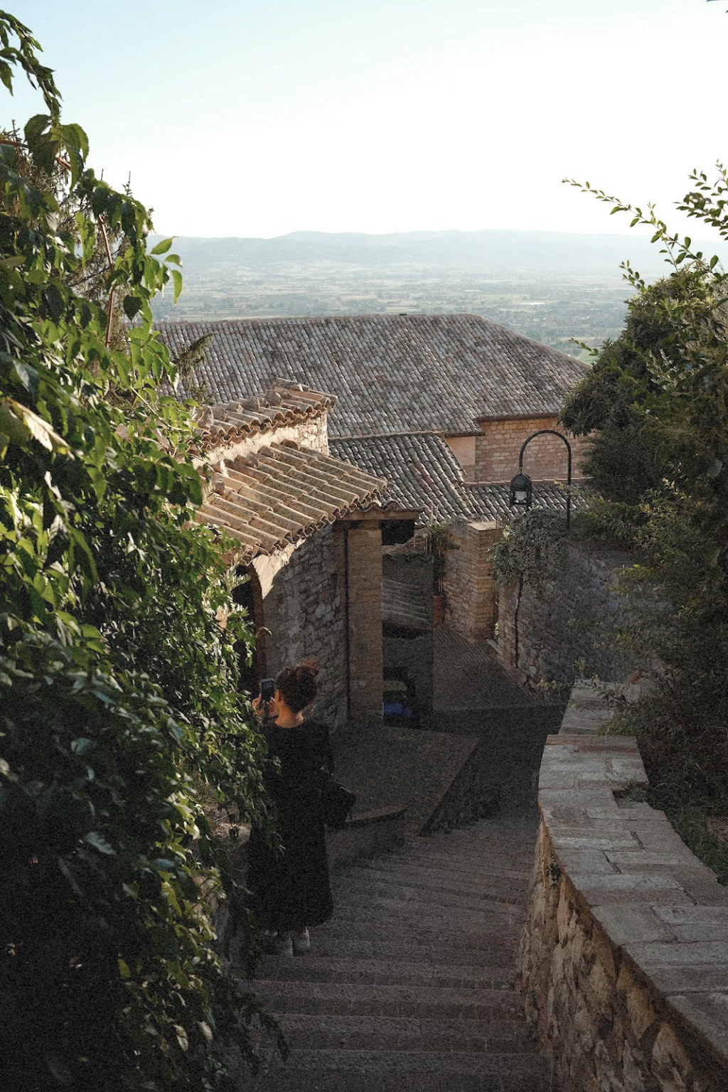Stone rooftops and a hillside view